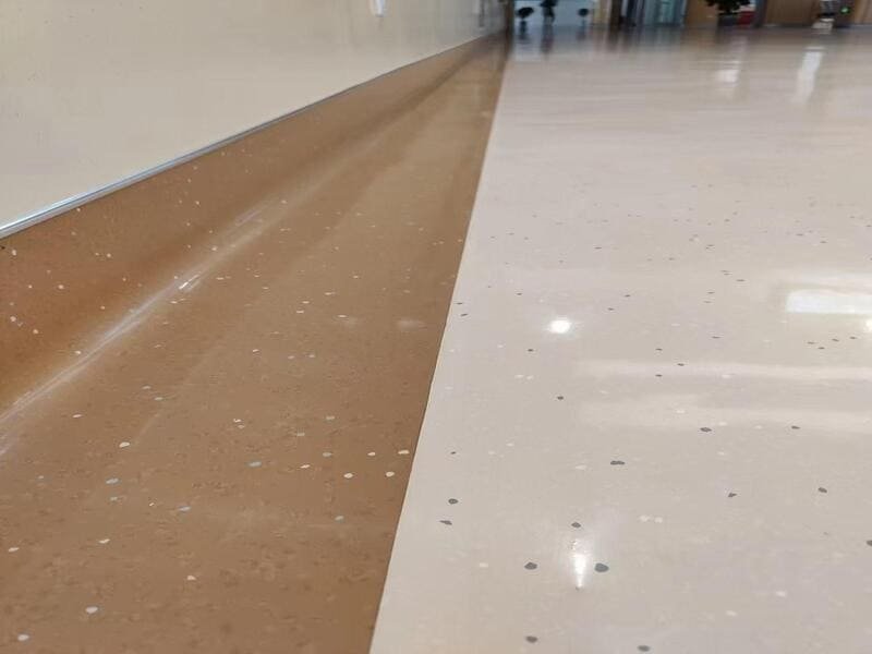 Using a 100 lb roller for consistent adhesion